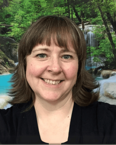 headshot of a smiling middle-aged female caucasian instructor