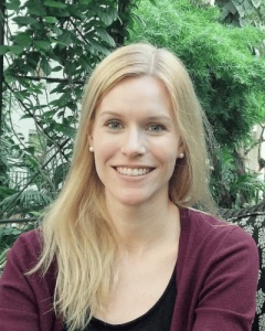 headshot of a smiling female caucasian psychologist with long blond hair